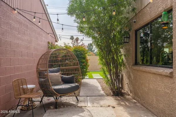 a backyard of a house with outdoor seating and green space