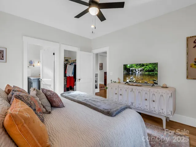 a bathroom with a shower a toilet and a sink