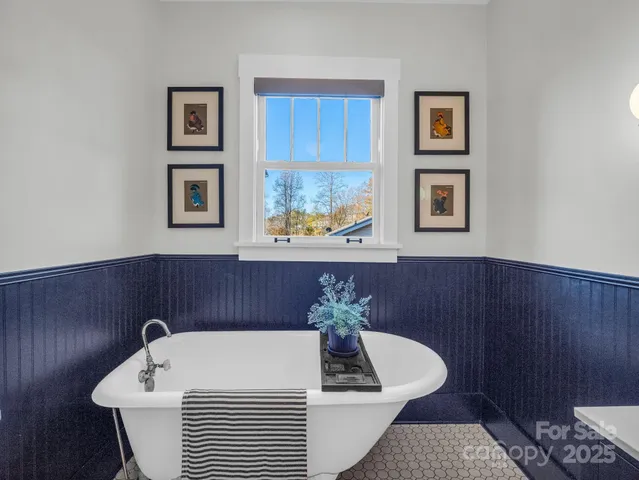 a view of a two chairs and table on the wooden floor