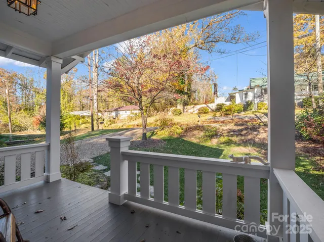 a living room with furniture rug and window