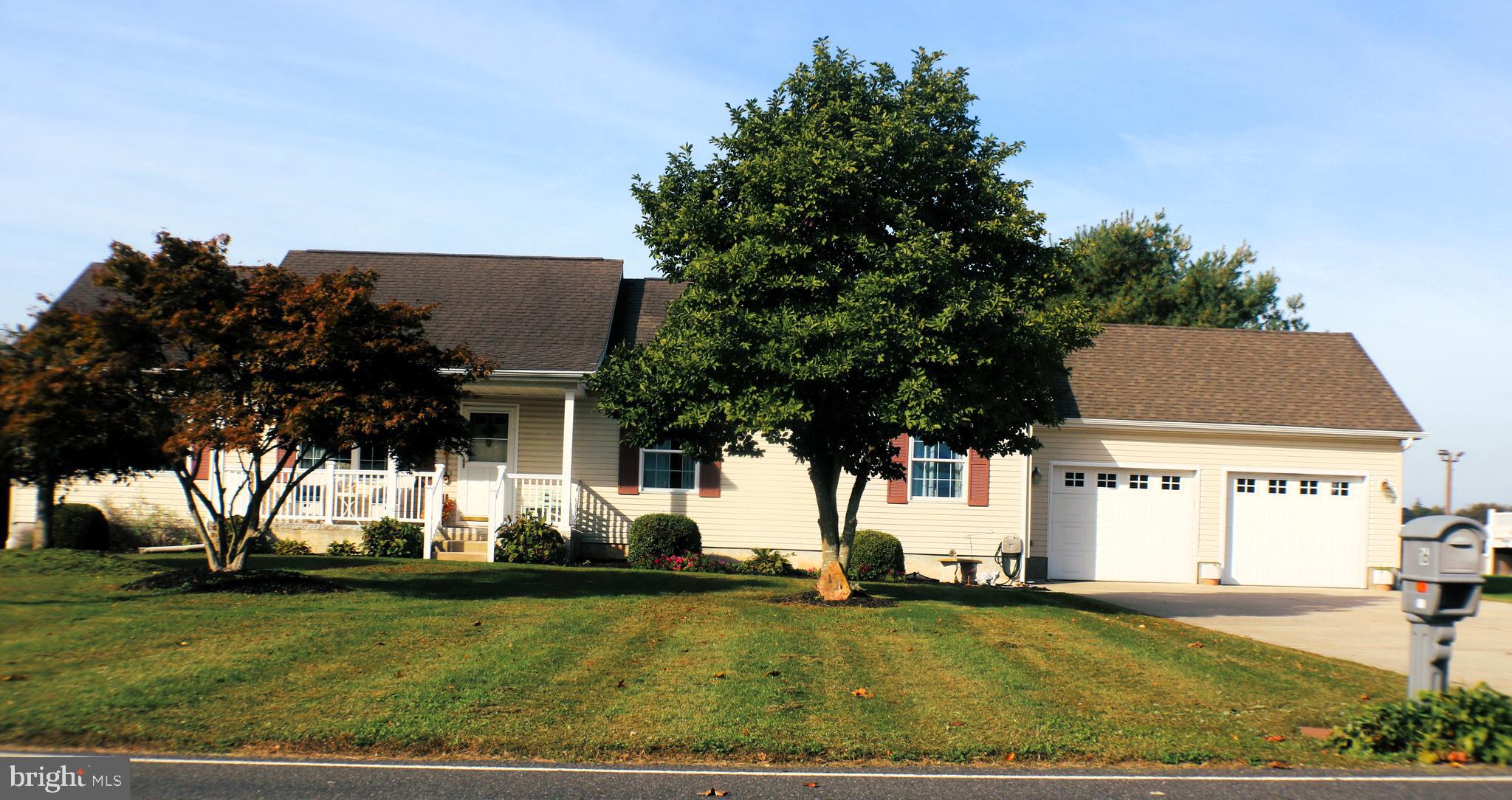 a view of a house with pool and yard