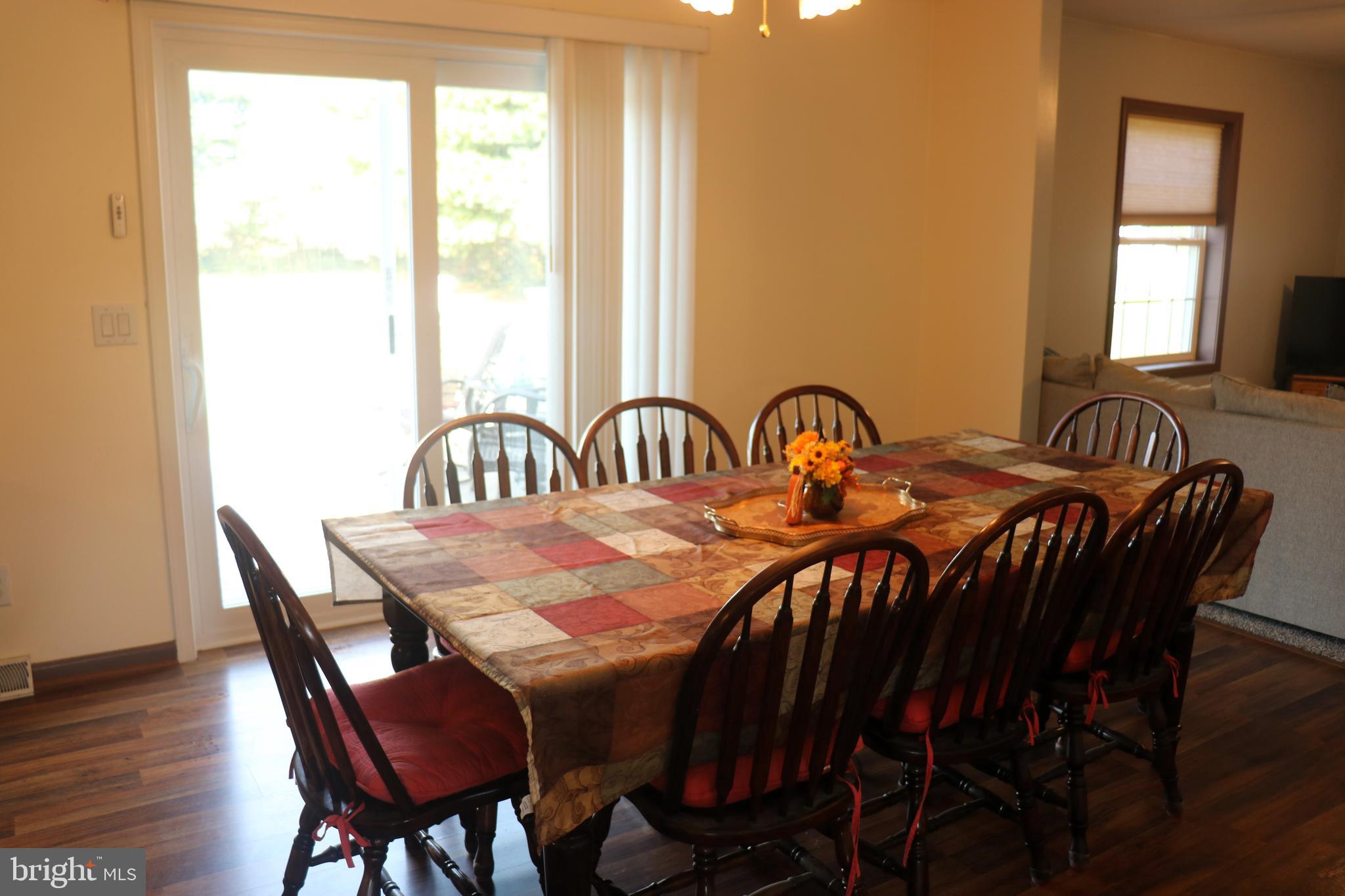 16 Kinkle Road Bridgeton, NJ 08302 - Photo 17 of 31 a view of a dining room with furniture and wooden floor