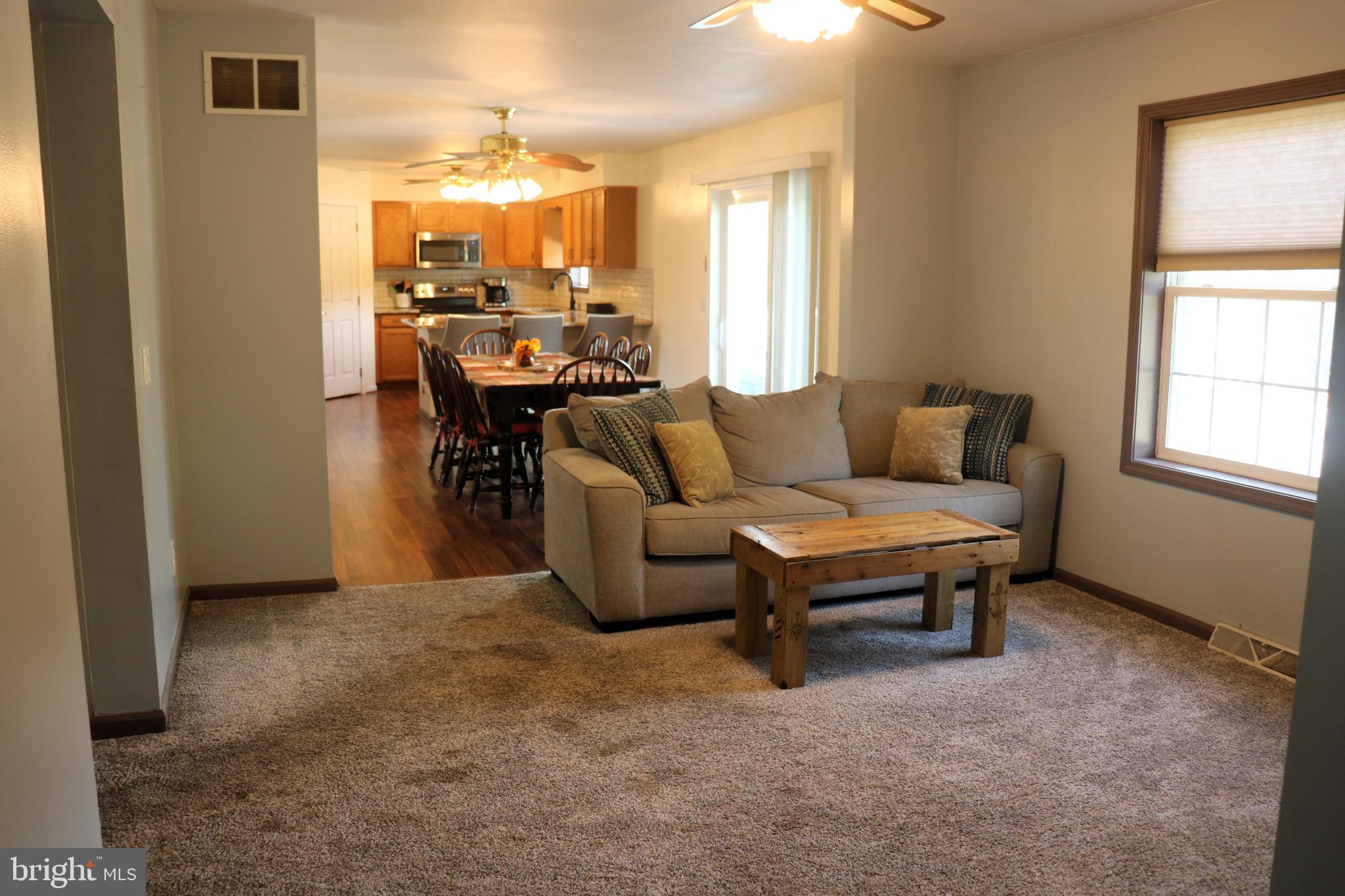 16 Kinkle Road Bridgeton, NJ 08302 - Photo 19 of 31 a living room with furniture and a chandelier