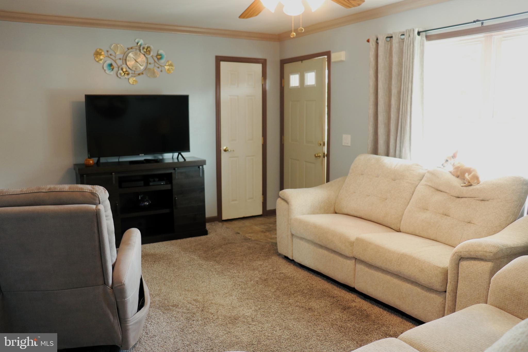 16 Kinkle Road Bridgeton, NJ 08302 - Photo 7 of 31 a living room with furniture and a flat screen tv
