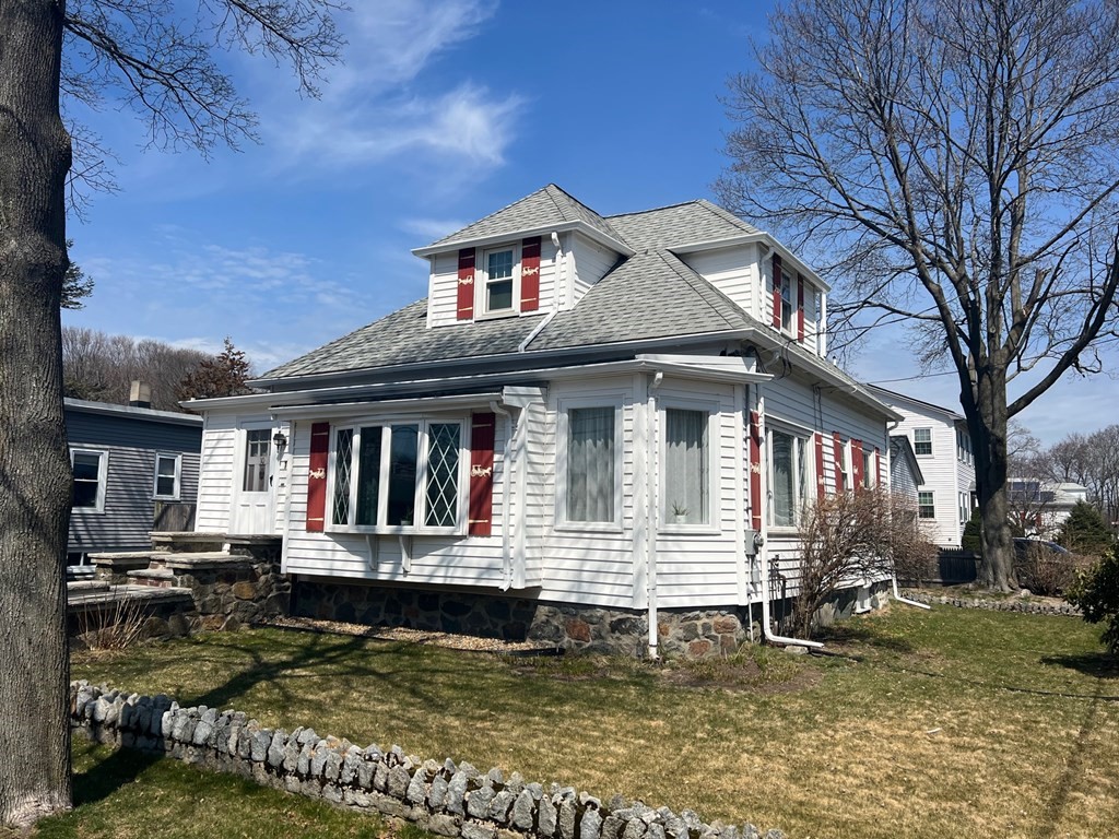 10 Guild Road Saugus, MA 01906 - Photo 1 of 7 a front view of a house with a yard outdoor seating and garage