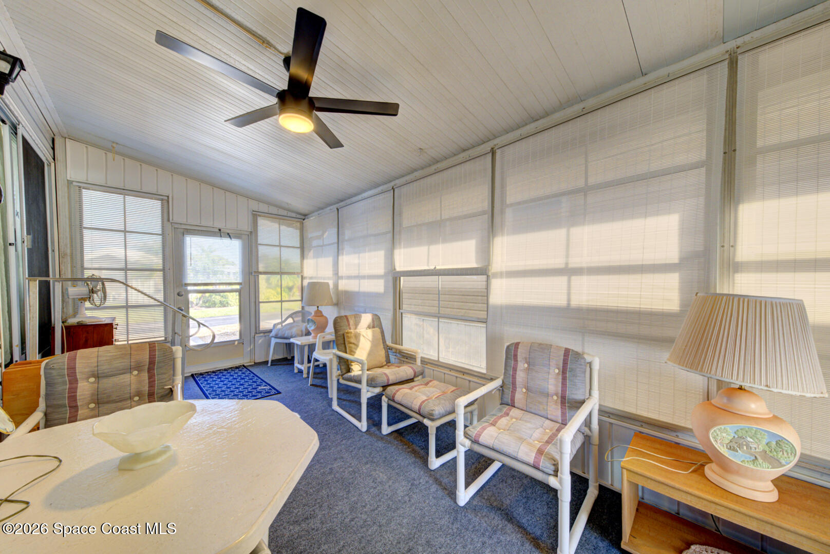 283 Buffalo Place Rockledge, FL 32955 - Photo 7 of 23 a living room with furniture and a large window