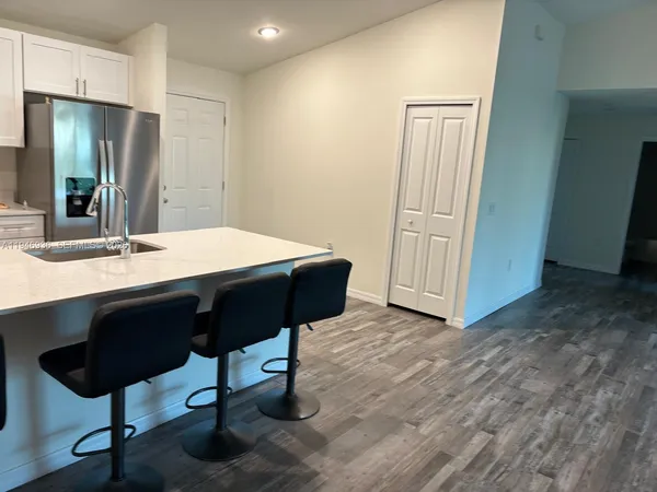 a dining room with a table and chairs