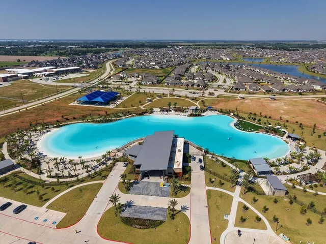 an aerial view of a house with a ocean view