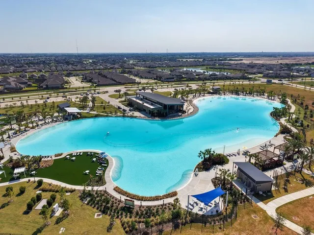an aerial view of a house with a lake view