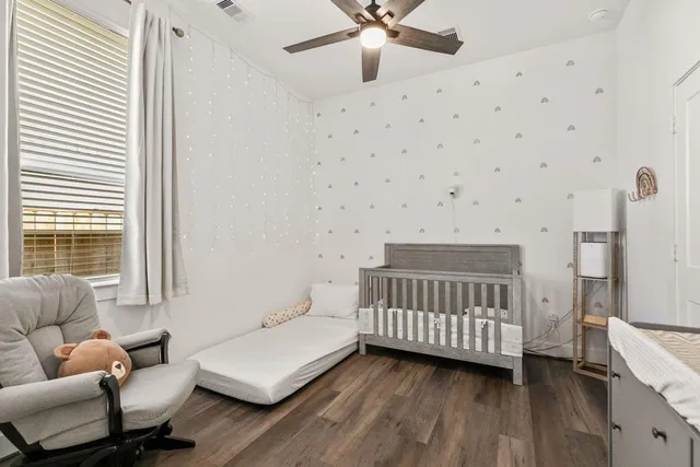 a bedroom with furniture and a window
