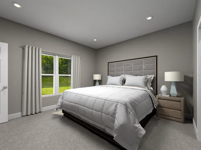 a bed room with a bed and a chair