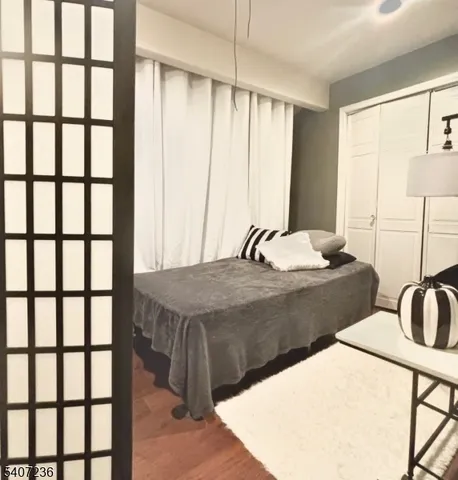a bathroom with a sink vanity mirror and toilet
