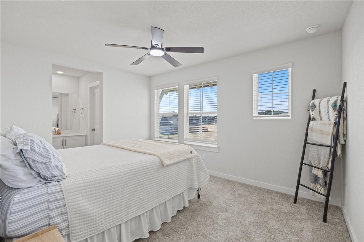 1027 Haystack New Braunfels, TX 78130 - Photo 10 of 15 a bedroom with a bed and a window