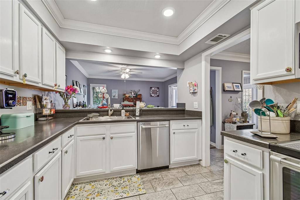 6543 Trail Ridge Drive, Unit 6543 Lakeland, FL 33813 - Photo 13 of 54 a kitchen with sink and cabinets