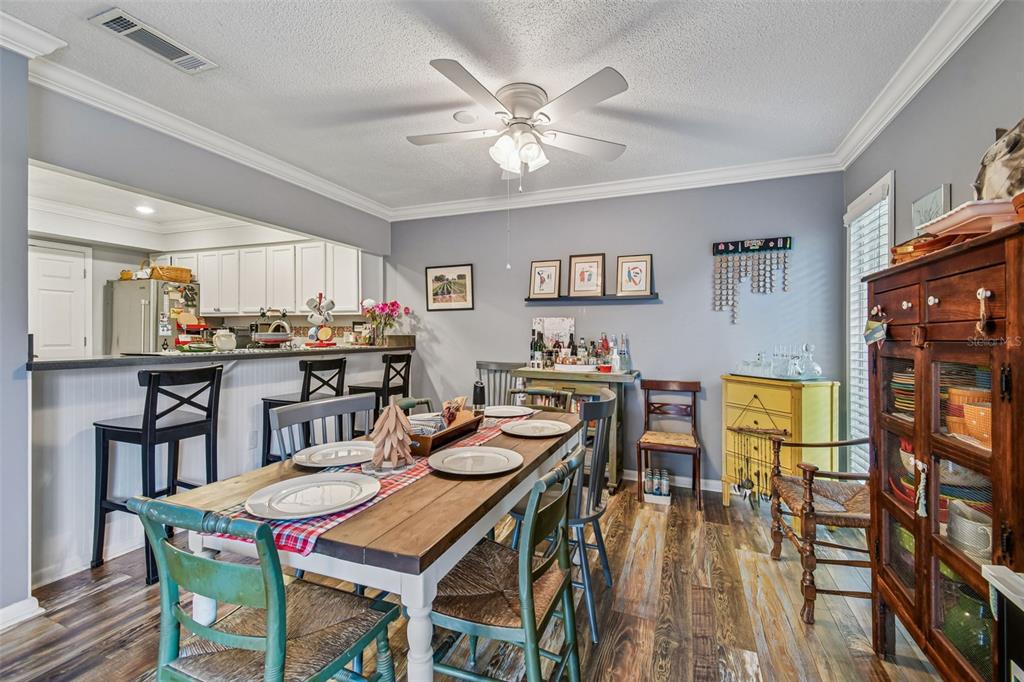 6543 Trail Ridge Drive, Unit 6543 Lakeland, FL 33813 - Photo 18 of 54 a view of a dining room with furniture and a chandelier
