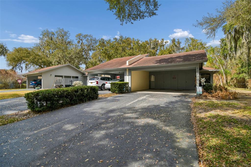 6543 Trail Ridge Drive, Unit 6543 Lakeland, FL 33813 - Photo 2 of 54 a view of house with outdoor space and garden