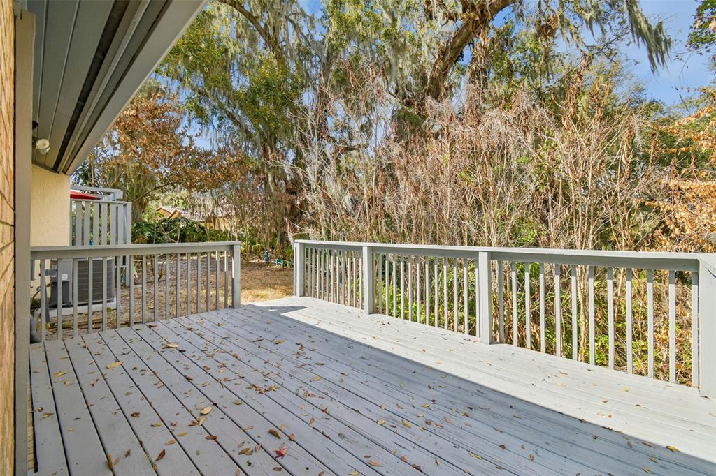 6543 Trail Ridge Drive, Unit 6543 Lakeland, FL 33813 - Photo 23 of 54 a view of balcony with wooden floor and fence