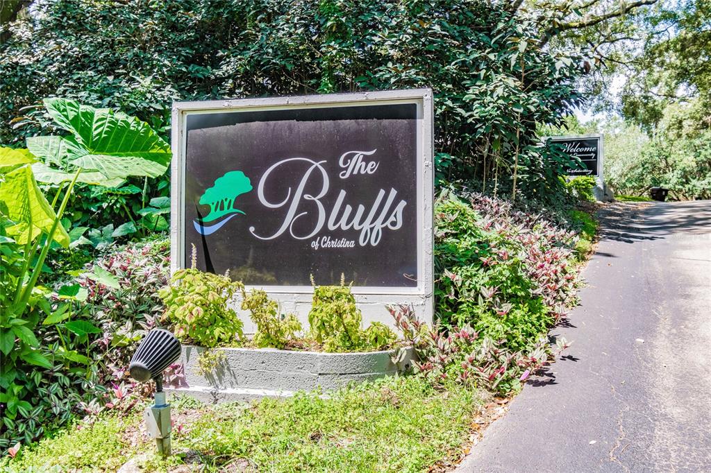 6543 Trail Ridge Drive, Unit 6543 Lakeland, FL 33813 - Photo 3 of 54 a sign that is in front of flowers