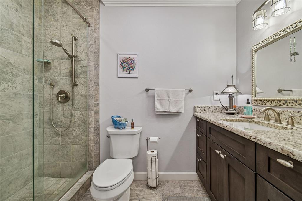 6543 Trail Ridge Drive, Unit 6543 Lakeland, FL 33813 - Photo 35 of 54 a bathroom with a granite countertop toilet sink and shower
