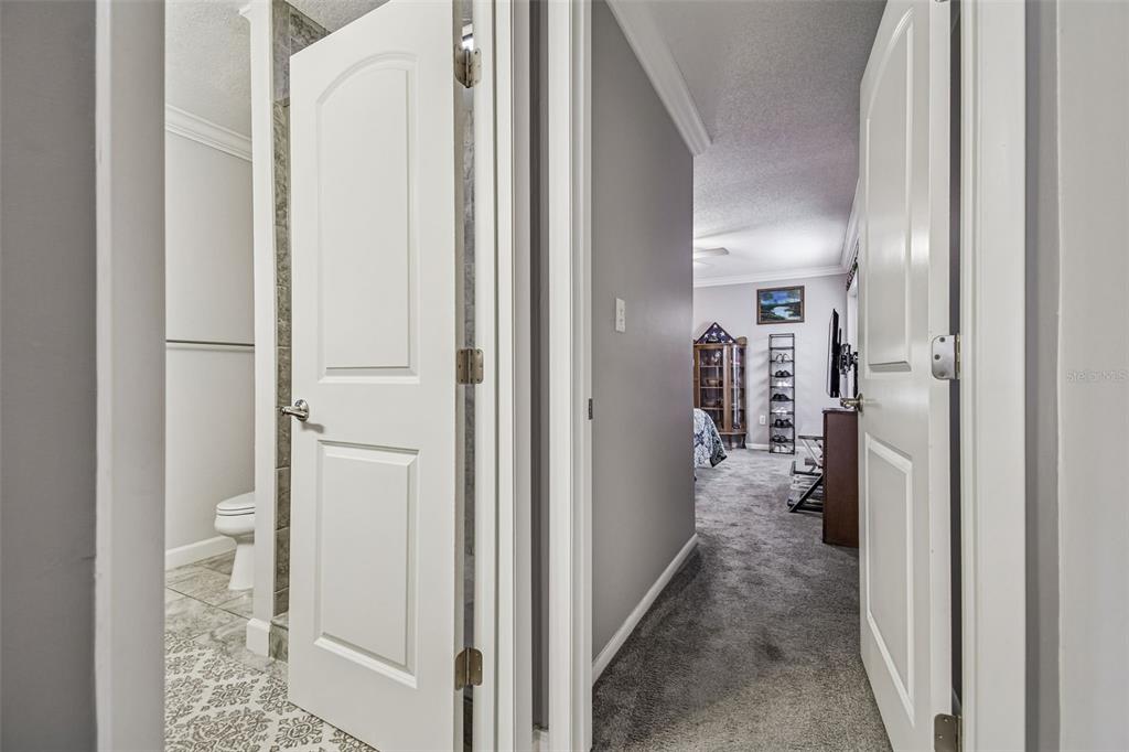 6543 Trail Ridge Drive, Unit 6543 Lakeland, FL 33813 - Photo 36 of 54 a view of a bathroom from a hallway