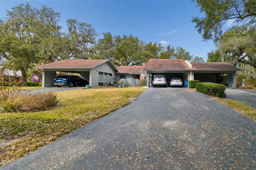 6543 Trail Ridge Drive, Unit 6543 Lakeland, FL 33813 - Photo 49 of 54 a view of a house with a yard patio and a tree