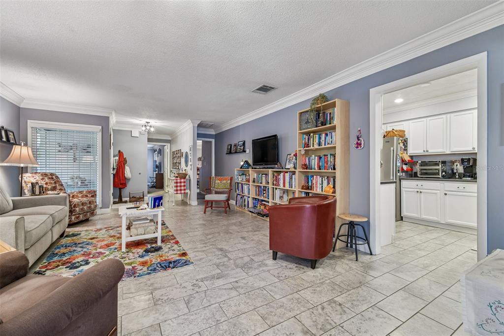 6543 Trail Ridge Drive, Unit 6543 Lakeland, FL 33813 - Photo 10 of 54 a living room with furniture and a flat screen tv