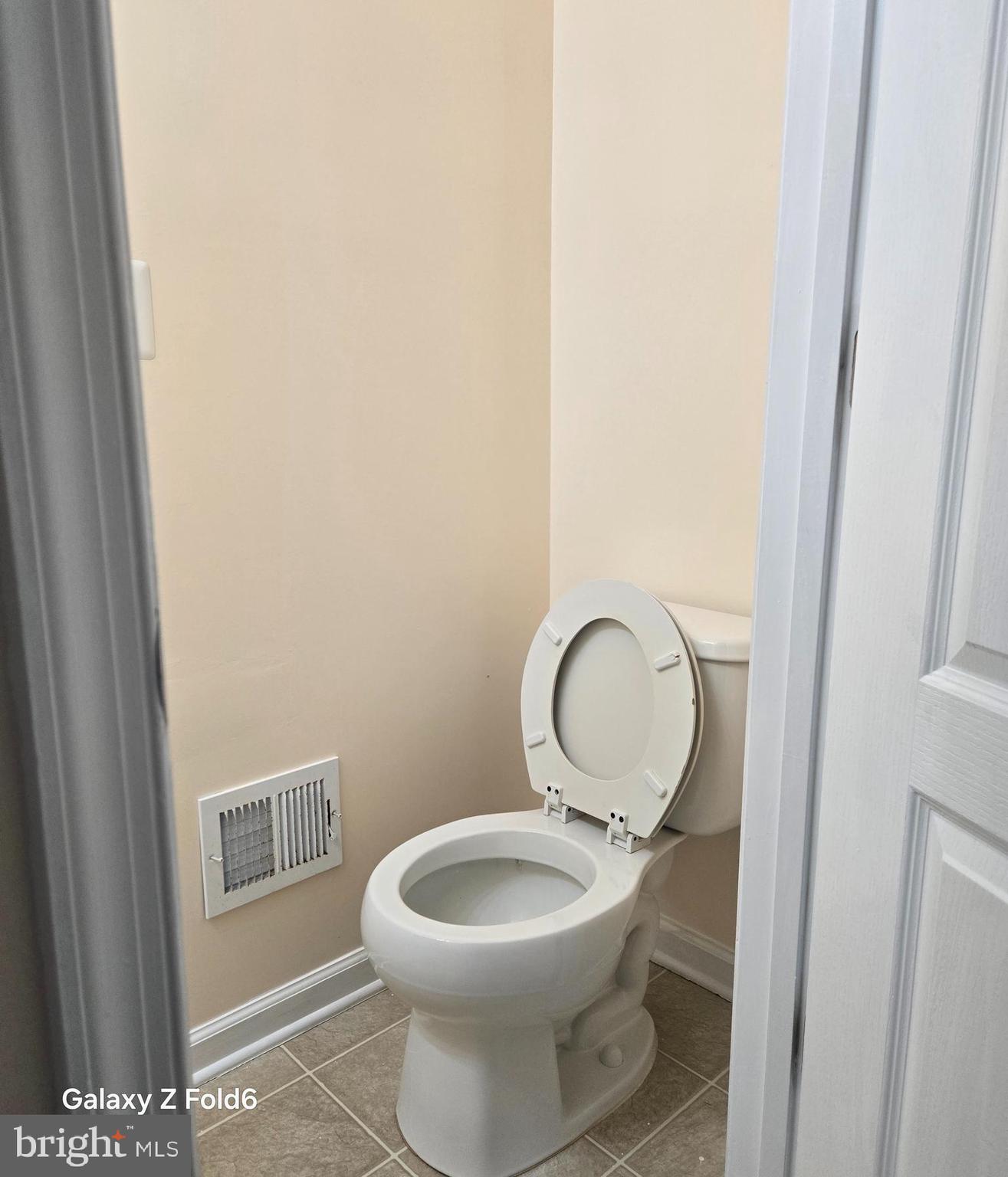 188 Joppa Farm Road Joppa, MD 21085 - Photo 12 of 28 a bathroom with a toilet a sink and a mirror