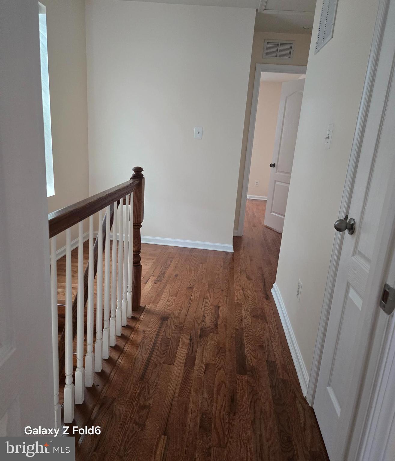 188 Joppa Farm Road Joppa, MD 21085 - Photo 14 of 28 a view of a hallway with wooden floor and staircase