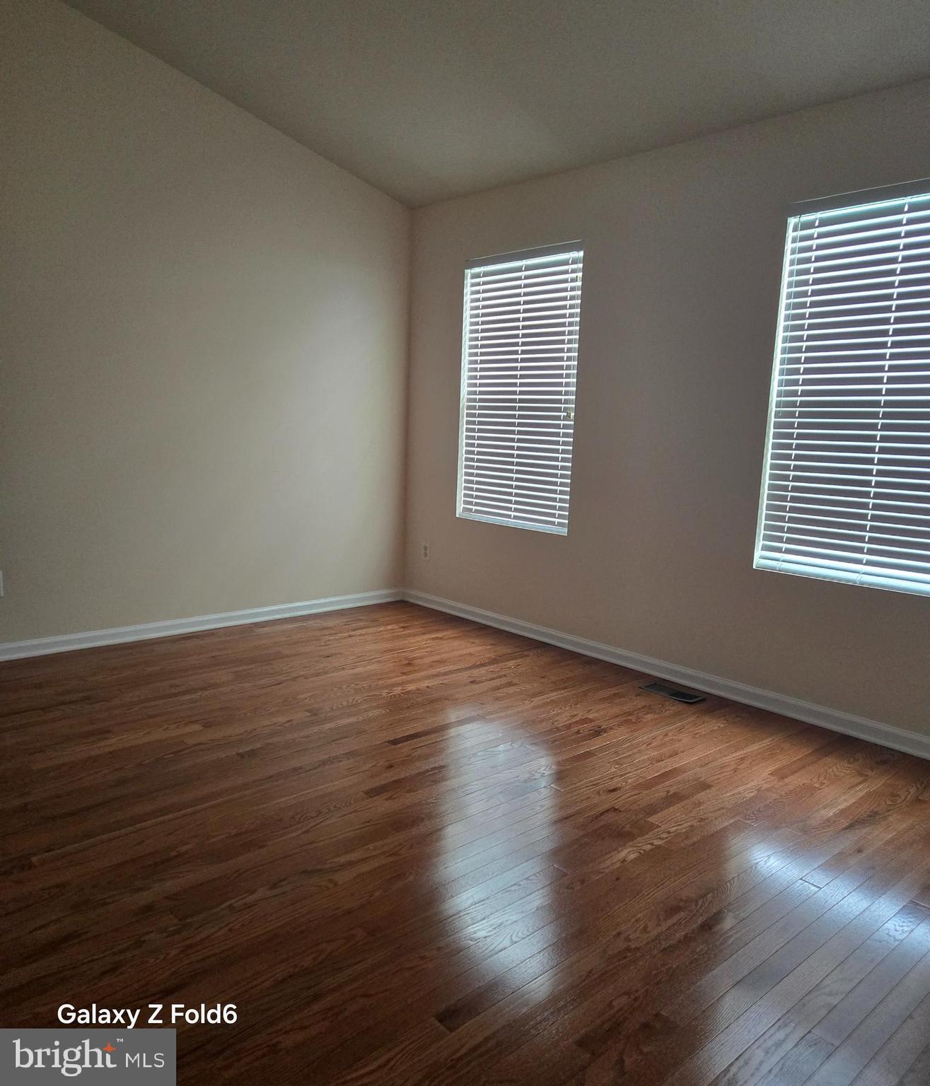 188 Joppa Farm Road Joppa, MD 21085 - Photo 16 of 28 a view of an empty room with wooden floor and a window