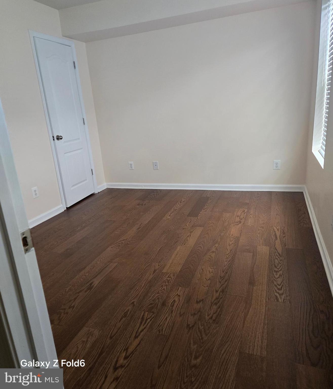 188 Joppa Farm Road Joppa, MD 21085 - Photo 17 of 28 a view of an empty room with wooden floor and a window