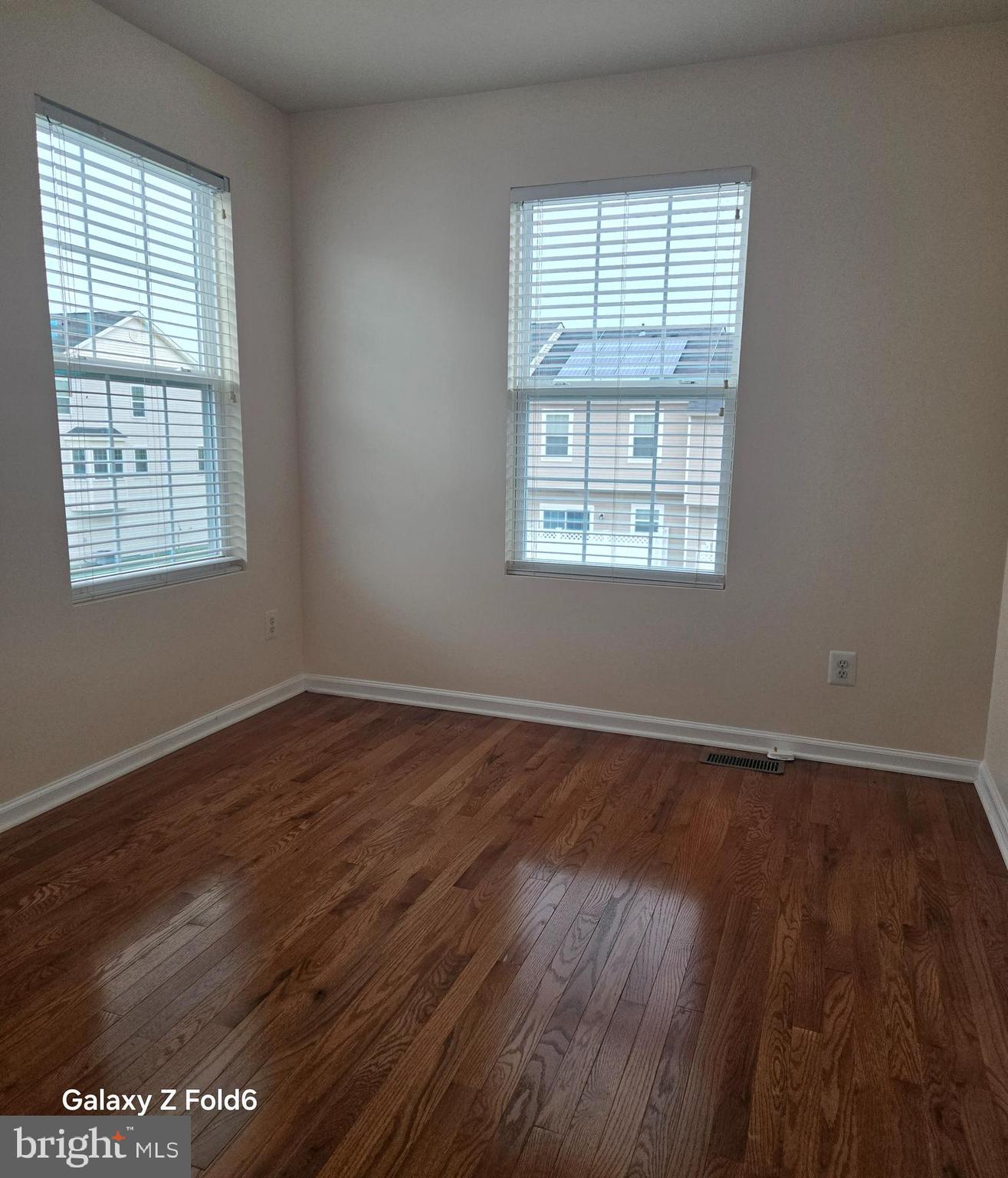 188 Joppa Farm Road Joppa, MD 21085 - Photo 20 of 28 an empty room with wooden floor and windows