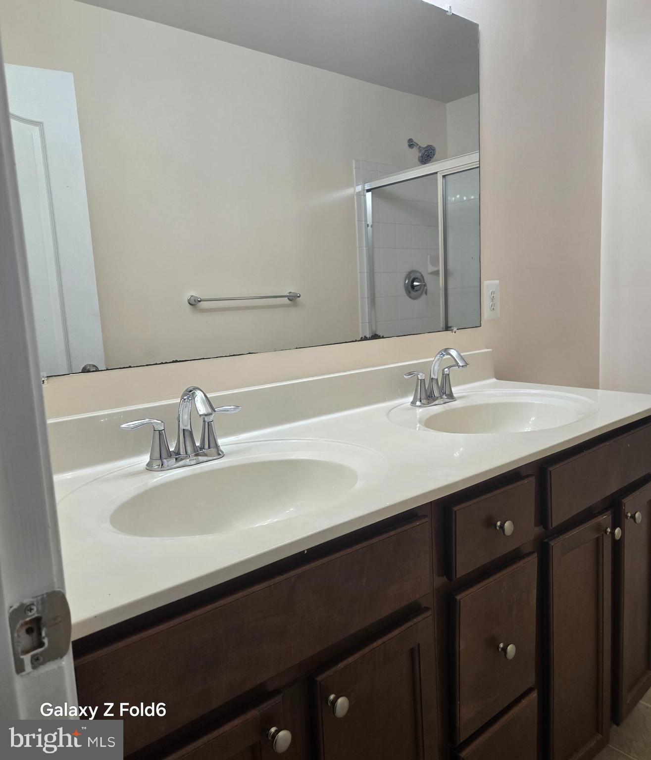 188 Joppa Farm Road Joppa, MD 21085 - Photo 25 of 28 a bathroom with a sink double vanity and a mirror