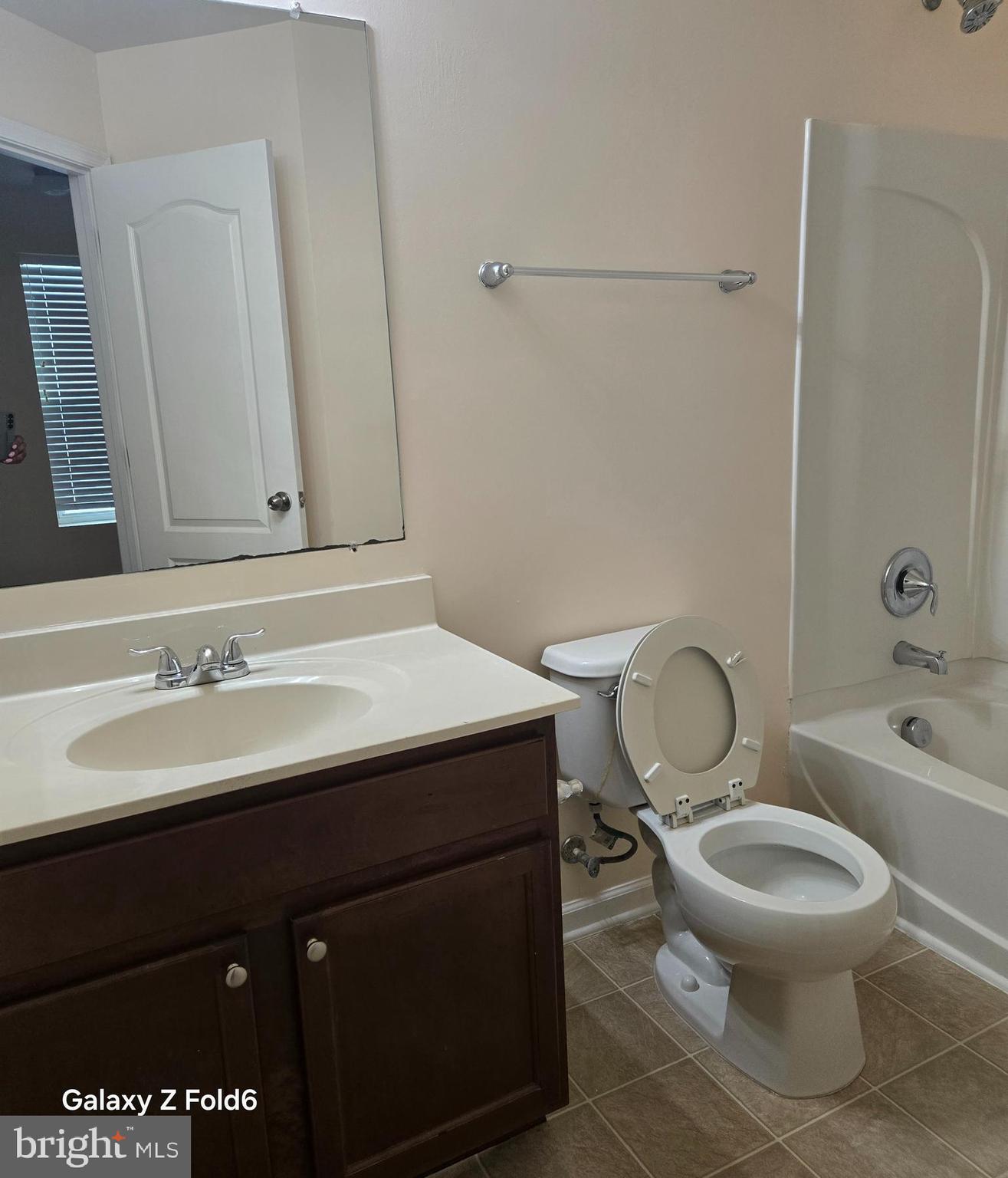 188 Joppa Farm Road Joppa, MD 21085 - Photo 26 of 28 a bathroom with a sink toilet vanity and tub