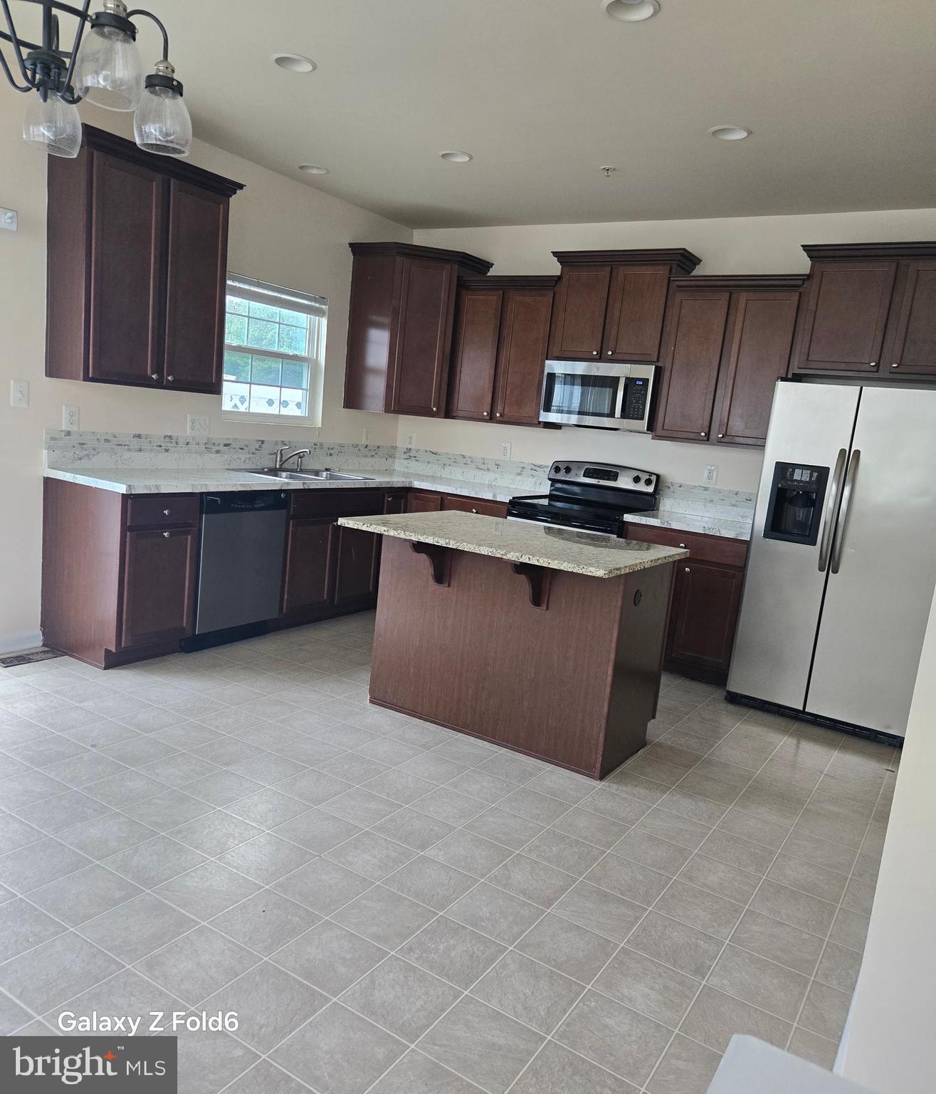 188 Joppa Farm Road Joppa, MD 21085 - Photo 7 of 28 a kitchen with stainless steel appliances granite countertop a stove a sink dishwasher and a refrigerator