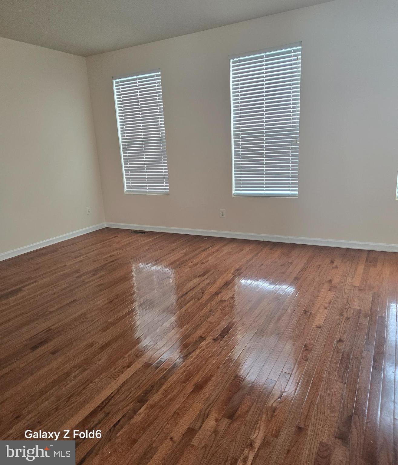 188 Joppa Farm Road Joppa, MD 21085 - Photo 8 of 28 wooden floor in an empty room with a window