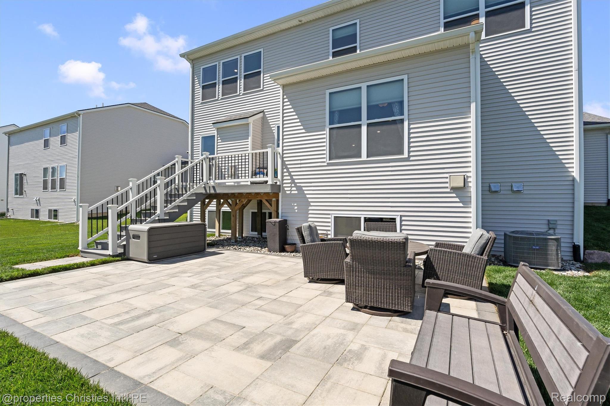 2721 Maize Loop Saline, MI 48176 - Photo 42 of 52 Rear view of property with a lawn, a patio area, and a wooden deck