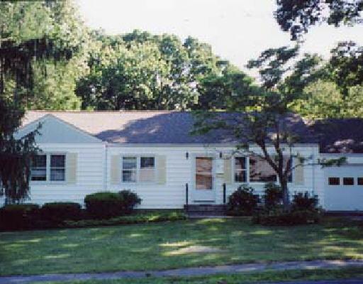 27 Berrian Road Stamford, CT 06905 - Photo 1 of 1 a front view of a house with a garden