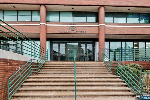 a view of a building with stairs and wooden floor