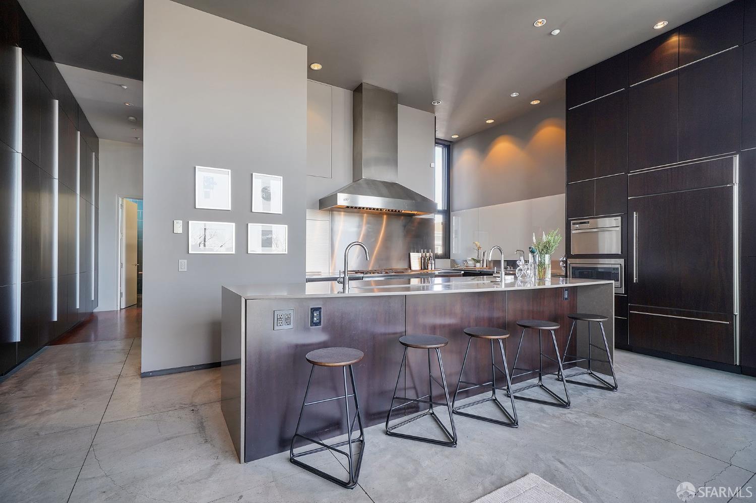 55 Sheridan San Francisco, CA 94103 - Photo 11 of 30 a dining room with furniture and a chandelier