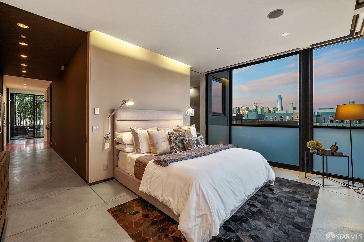 55 Sheridan San Francisco, CA 94103 - Photo 19 of 30 a bedroom with a large bed and a large window