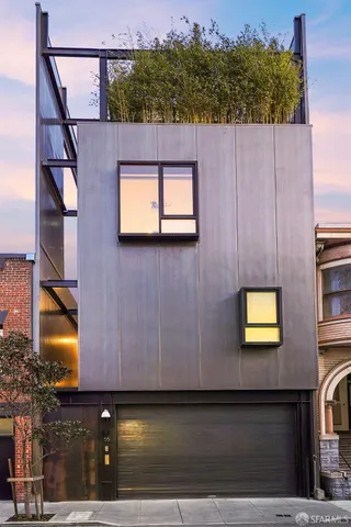 a view of a street with stairs and a car parked on the road