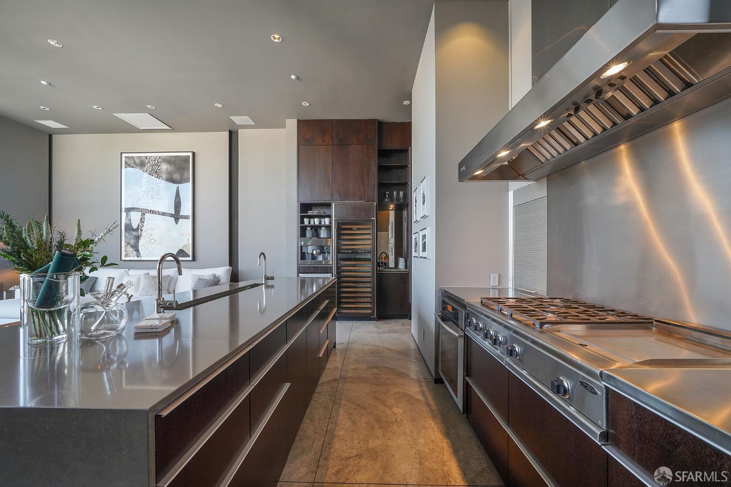 55 Sheridan San Francisco, CA 94103 - Photo 9 of 30 a kitchen with stainless steel appliances granite countertop a lot of counter space and wooden floors