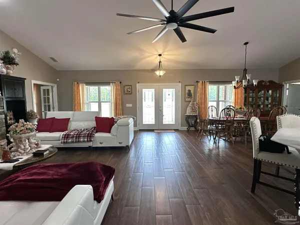 a bedroom with a bed and a mirror