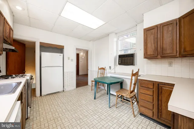 a view of a workspace with furniture