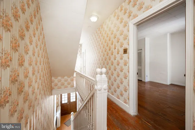 a view of an entryway with wooden floor