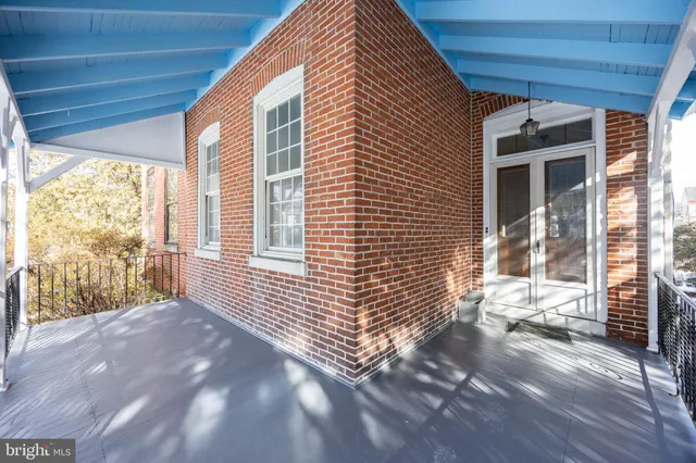 a view of backyard with large windows