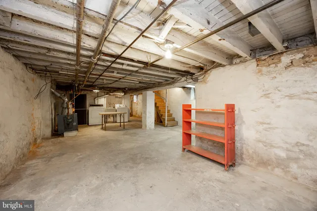 a view of empty room with wooden ceiling