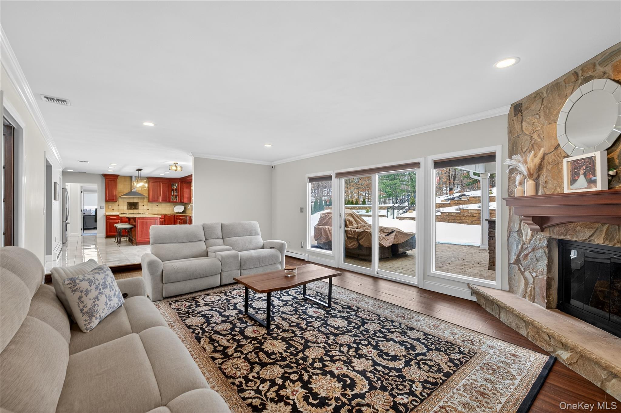 53 Timber Ridge Drive Commack, NY 11725 - Photo 14 of 50 a living room with furniture wooden floor and a fireplace