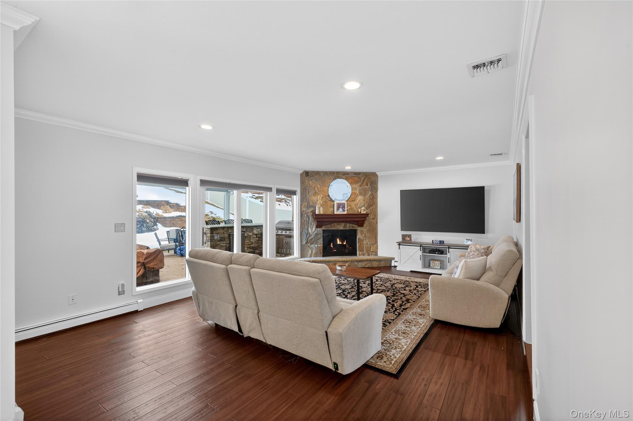 53 Timber Ridge Drive Commack, NY 11725 - Photo 15 of 50 a living room with furniture and a flat screen tv