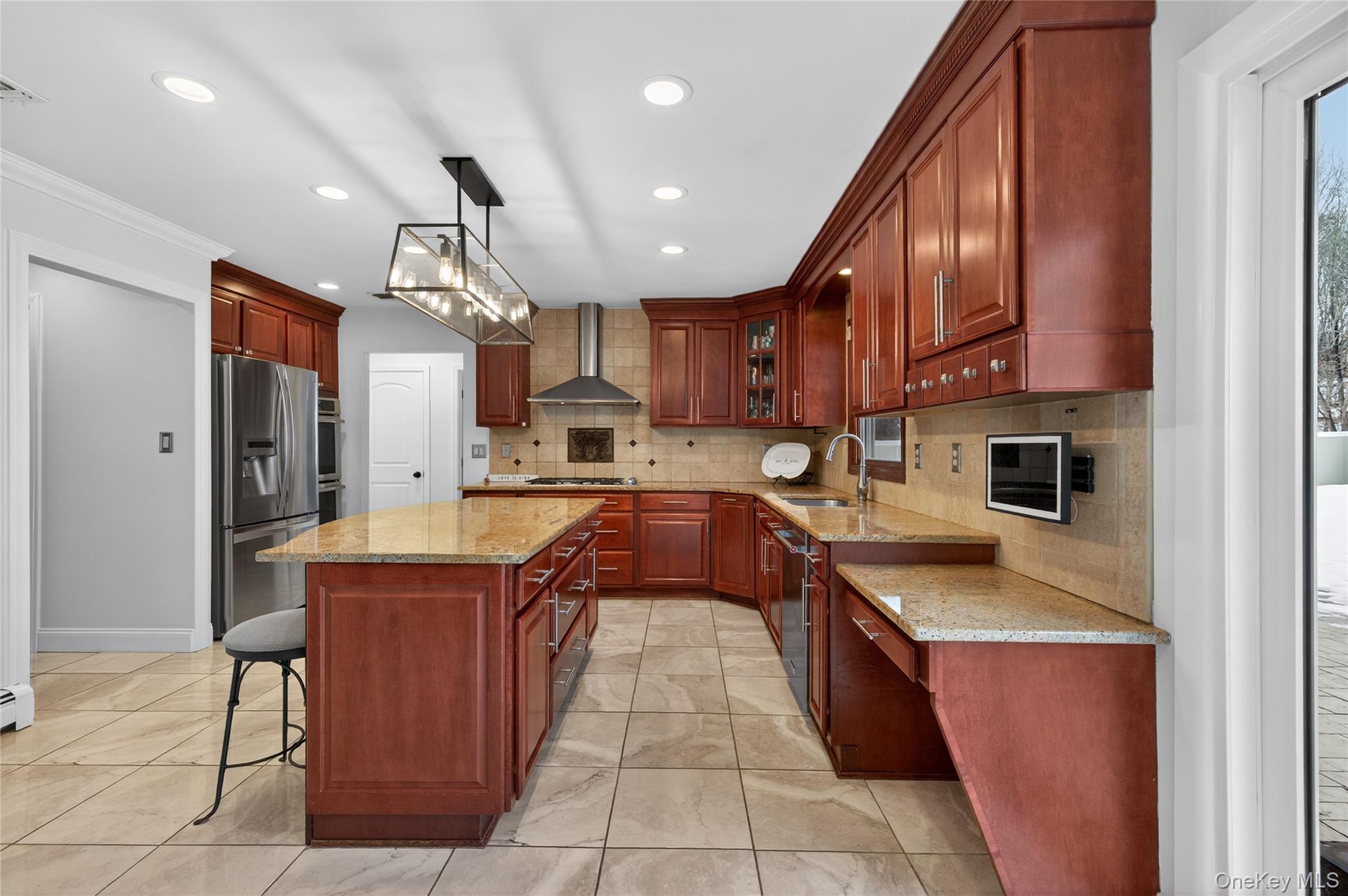 53 Timber Ridge Drive Commack, NY 11725 - Photo 22 of 50 a large kitchen with stainless steel appliances granite countertop a stove a sink dishwasher and a refrigerator